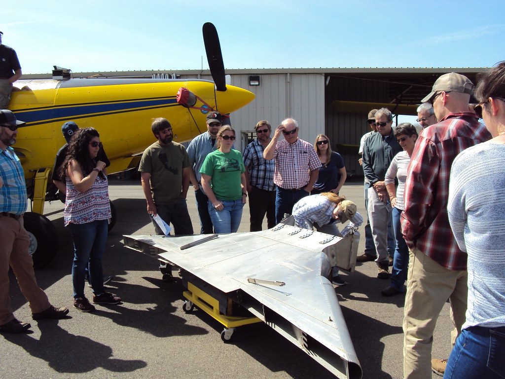 2018. Shawna Bautista (R6 FHP) inspecting fertilizer spreader. Aerial Pesticide Application Training (APAT). D
