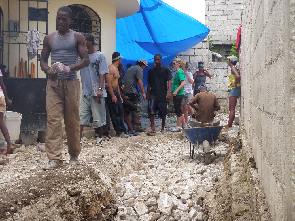 Once the ditch was dug, we filled it with rocks, creating a french drain.